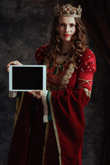 medieval queen in red dress digital tablet blank screen