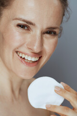 happy young woman with cotton pad