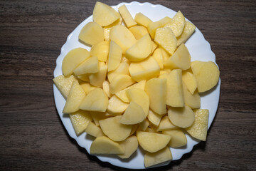 Peeled and sliced ​​potatoes in a plate