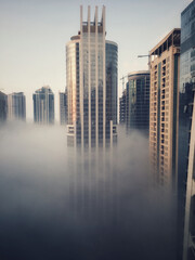 Dubai golden skyscrapers in sun and fog