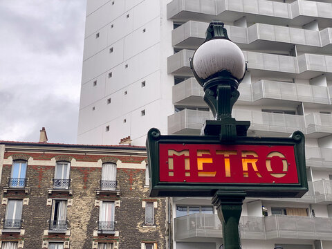 Paris Metro Sign Illuminated - Cityscape of France's Capital