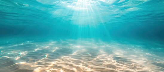 Fototapeta na wymiar blue tropical ocean underwater background with the summer sun shining