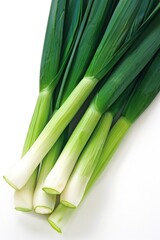 A bunch of green onions are displayed on a white background