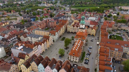 Bird's-eye view captures Jelenia Góra's bustling market square and 18th-century town hall.