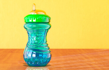 Sippy Cup for Babies and Toddlers on the wooden table. 3D rendering