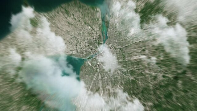 Zooming on Detroit, US. Earth zoom in from outer space to city. The animation continues by zoom out through clouds and atmosphere into space. View of the Earth at night. Images from NASA. 4K