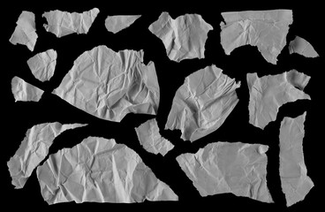 Torn and crumpled paper scraps, set, collection isolated on black background with clipping path