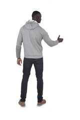 back view of a man shaking hands with an imaginary person on white background - 791086009