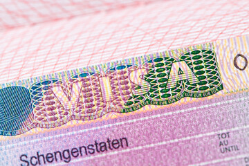 Europe schengen visa in the passport. Close up view. Visa stamp in passport or tourism and travel in EU.
