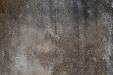 Front view of dirty and weathered wall with scratches on the surface. Abstract full frame textured grunge background with copy space.
