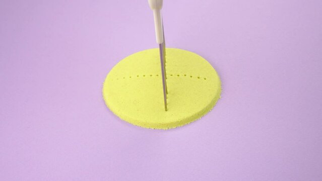 Very Satisfying and Relaxing Kinetic Sand ASMR. Cutting anti stress macro close up colorful Kinetic Sand with a Knife. Kinetic sand cutting with a knife on a black background. ASMR .