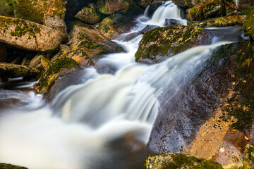 Beautiful view of the cascades of the river in the mountain valley