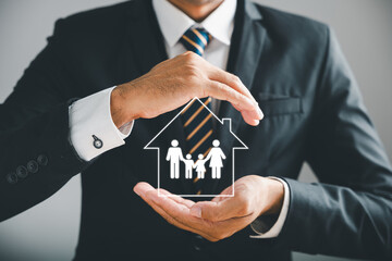 Businessman protective gesture symbolizes holistic insurance protection for family, life, health, and house. Icons distinctly emphasize family life insurance and policy concepts.