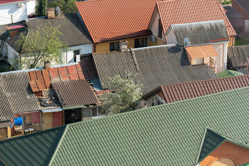 Aerial view of new and old house roofs