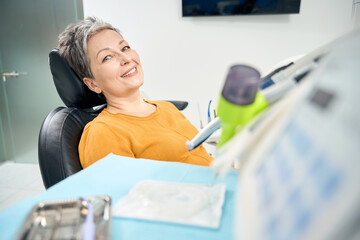 Woman visiting dentist office to check-up her teeth and oral cavity