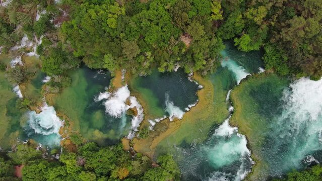 Aerial top view of beautiful Krka Waterfalls in Krka National Park, green foliage and turquoise water, Croatia, 4k