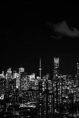 Fototapeta premium night Toronto city downtown skyline, twilight over CN Tower and skyscrapers of financial district Canada, black and white
