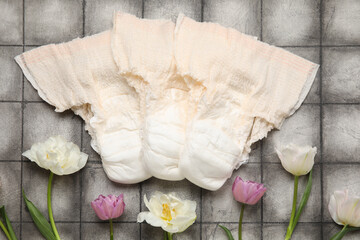 Period panties with flowers on dark tile background