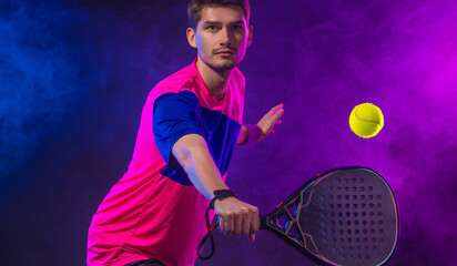 Padel Tennis Player with Racket in Hand. Paddle tenis, on a blue background. Download in high resolution. - 791115891