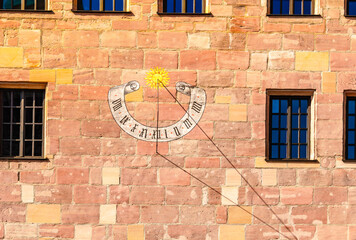 Old sundial on wall of house of Nuremberg, Bavaria, Germany. High quality photo