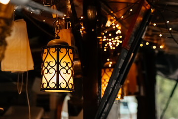 lamp with a white shade is hanging from the ceiling