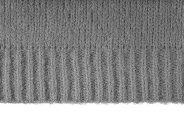 Gray knitted woolen jersey fabric, sweater, pullover texture with edge isolated on white,...