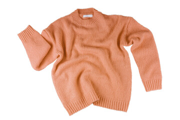 Orange flying crumpled women's autumn knitted sweater isolated on white, transparent background....