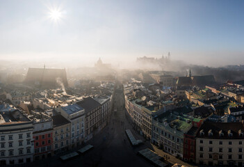 Aerial view of soft lighted Old Town (Grodzka Street) and Wawel Castle in Krakow during beautiful,...