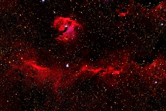 The cosmic nebula is red. Elements of this image furnished by NASA