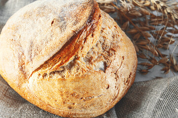 round rye sourdough bread. close-up. The concept of baking the most healthy bread from whole grain...