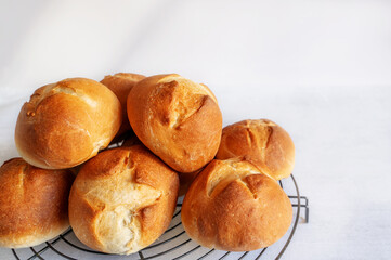 homemade buns. Homemade buns on wood board with wheat ears. Homemade Dinner Rolls, selective focus