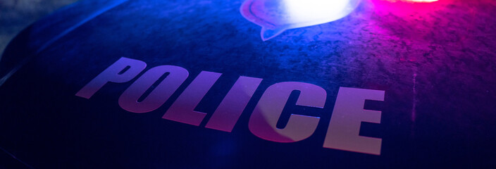 Front hood of a police car with "Police" written on it. stock photo