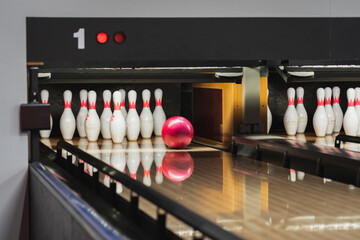 Bowling game, the ball rolls into the pins.