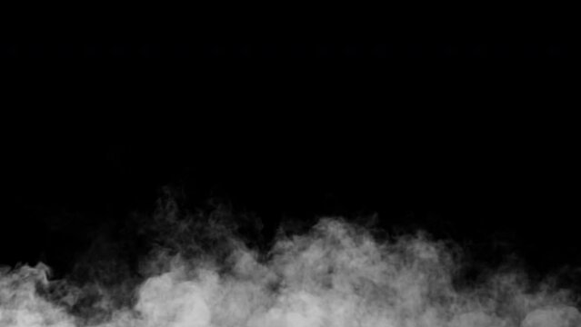 Turbulent cold steam or smoke. Swirly dust animation. Spooky mist background. Loop. Embedded alpha channel