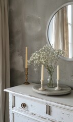 White Dresser With Mirror and Flower Vase