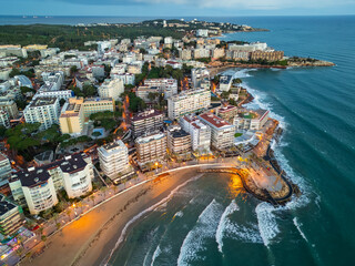 illuminated streets of Spanish touristic city Salou, Catalonia, aerial view of beach, sea and coast...