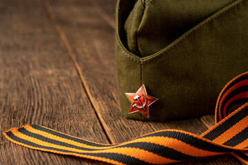 Cap with a star and George ribbon. The concept of the Great Victory Day.
