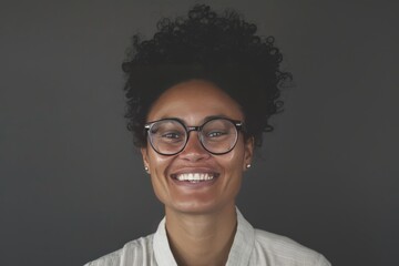 Smiling with Style: Person in Fashionable Glasses on Solid Background
