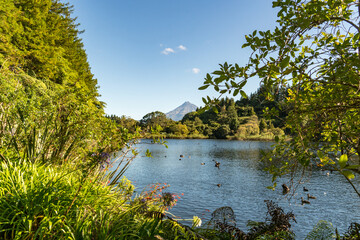 Lake Mangamahoe scenic view with volcanic Mt Taranaki in the background