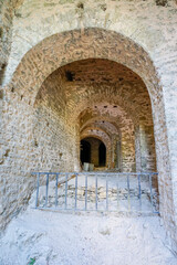 Fototapeta premium Part of ruins of arch-shaped structure of Ottoman architecture at Gjirokaster castle. Gjirokastner-Albania.