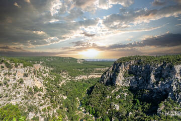 View of Güver Canyon, covered with steep cliffs and pine trees. Travel and picnic location,...