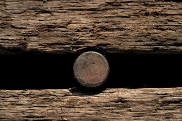 Railroad tie with nail, macro for rustic background, backdrop