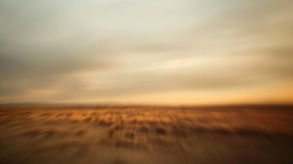 The blurred horizon in this defocused background invites the imagination to wander and conjure up visions of desert adventures with the muted colors creating a sense of mystery and . - obrazy, fototapety, plakaty