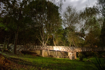 night photograph taken in 20 seconds long exposure of Cordoba landscape in Candonga, Argentina forest and river with silk effect stones