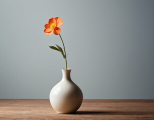 A small vase with one flower