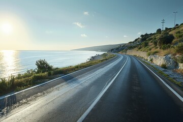 Fototapeta premium Empty asphalt road by the lake