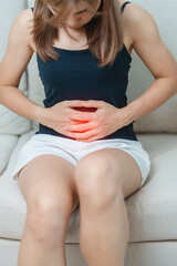 woman having abdomen ache due to Stomach pain, digestion with constipation or Diarrhea from food...