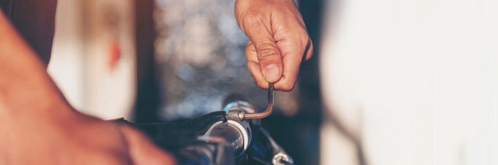 Banner Man hands fixing Car machinery vehicle mechanical service. Mechanic man hands repairing car shop. panoramaopen vehicle hood checking up auto mobile. Car maintenance engineer with copy sapce.