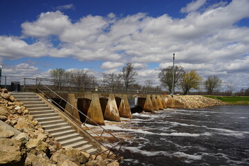 Stone water way dam on a Wisconsin river during early spring. 