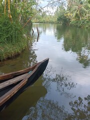 A canoe is a lightweight narrow water vessel, typically pointed at both ends and open on top, propelled by one or more seated or kneeling paddlers facing the direction of travel and using paddles.
